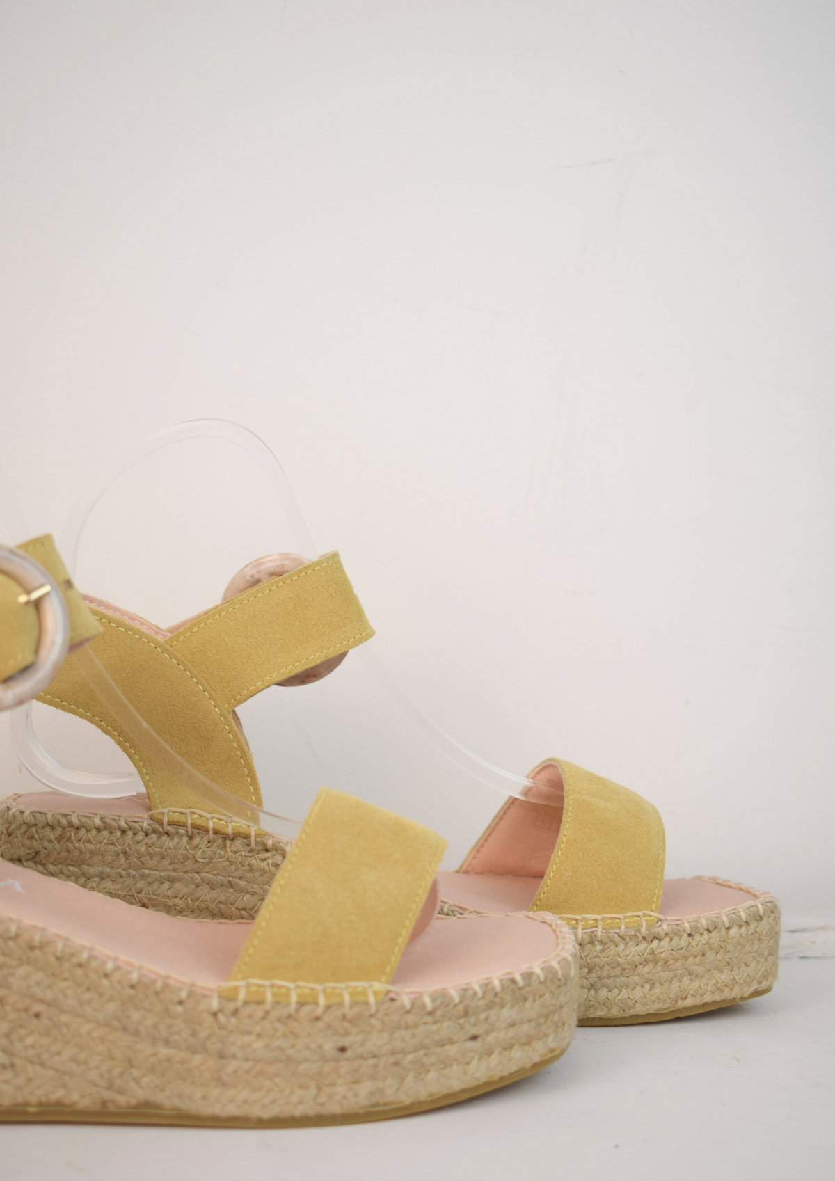 Sand coloured flatfrom sandle with ankle strap and buckle 