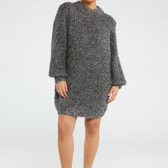 Chunky knit silver tinsel style short dress with crew neckline and long full sleeves with ribbed cuffs