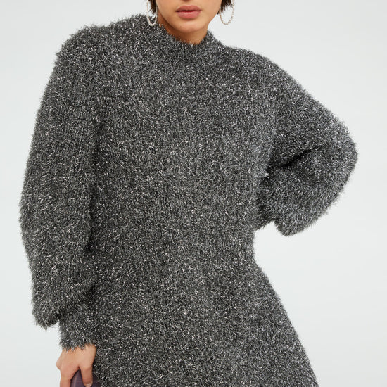 Chunky knit silver tinsel style short dress with crew neckline and long full sleeves with ribbed cuffs