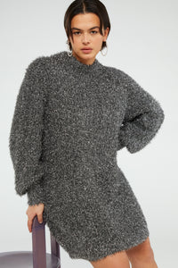 Chunky knit silver tinsel style short dress with crew neckline and long full sleeves with ribbed cuffs