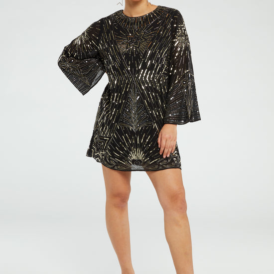 Black mini dress with long wide sleeves and gold sequin details throughout