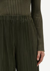 Close up view of elasticated waistband Uma Trousers in Forest Green  