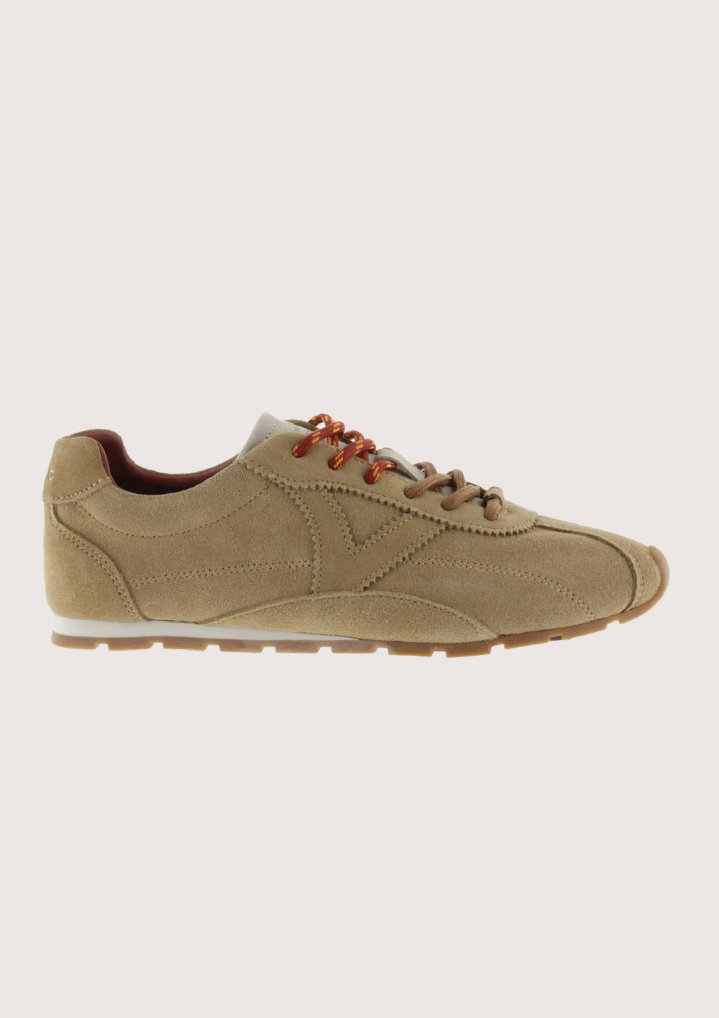 Brown suede shoe on a white background