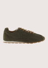 Khaki suede sneaker with beige sole on a plain background