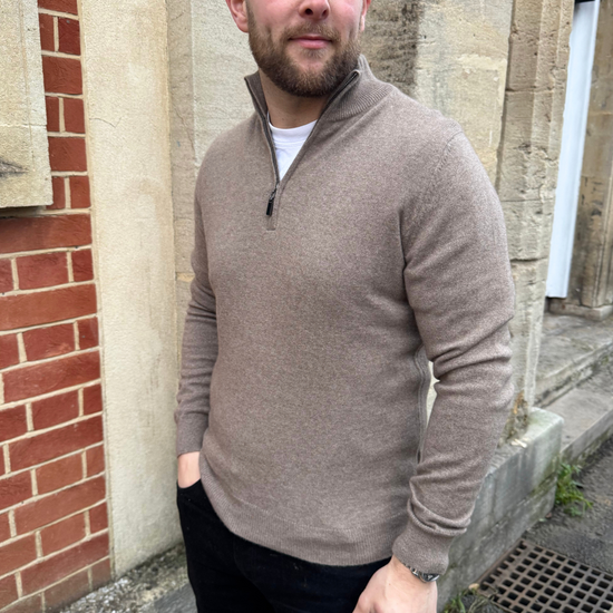 male model wearing brown cashmere quarter zip jumper.