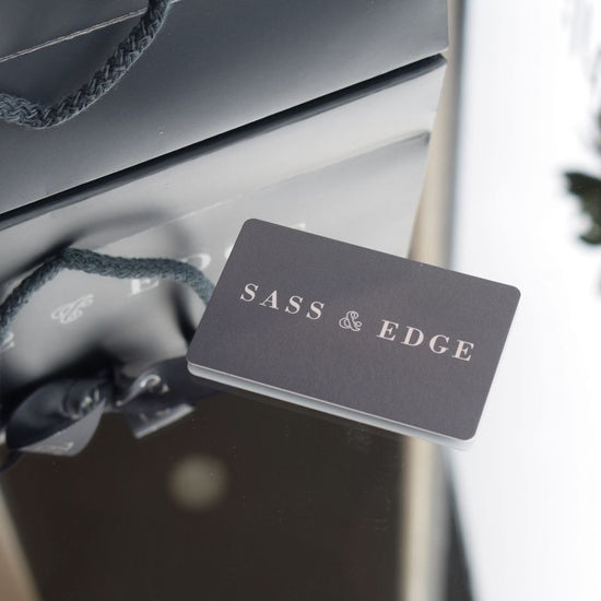 Image of a gift card layed on a mirror 