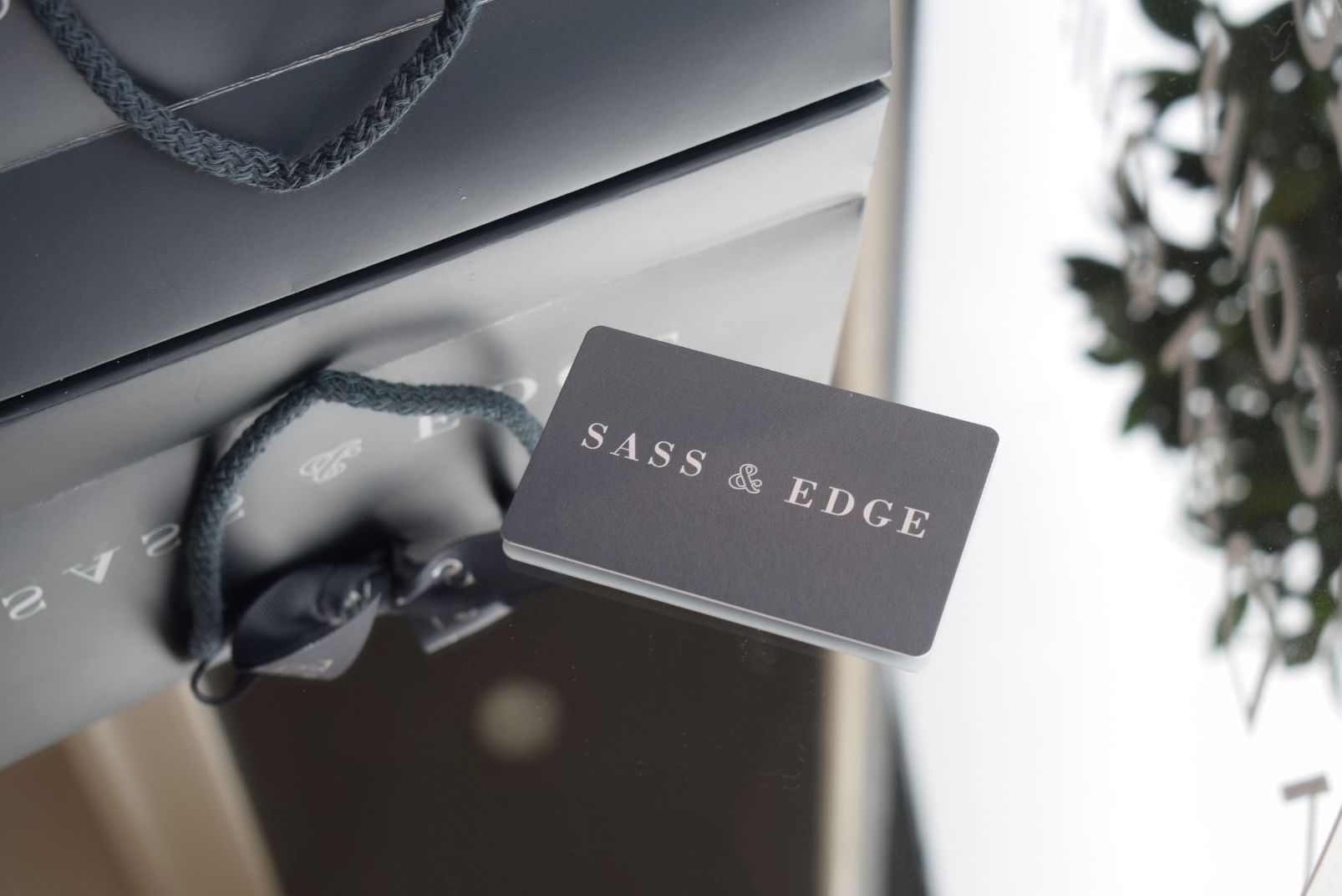 Image of a gift card layed on a mirror 