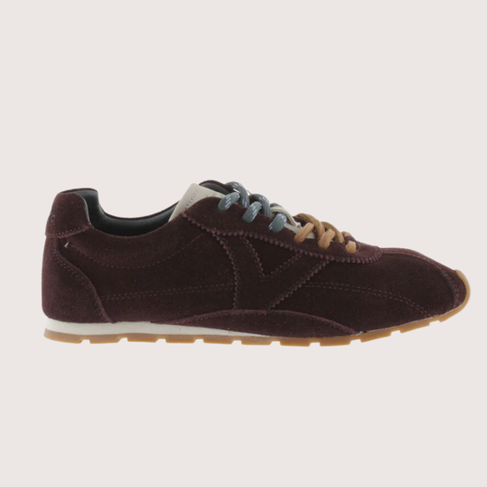 Brown suede sneaker with beige sole on a white background