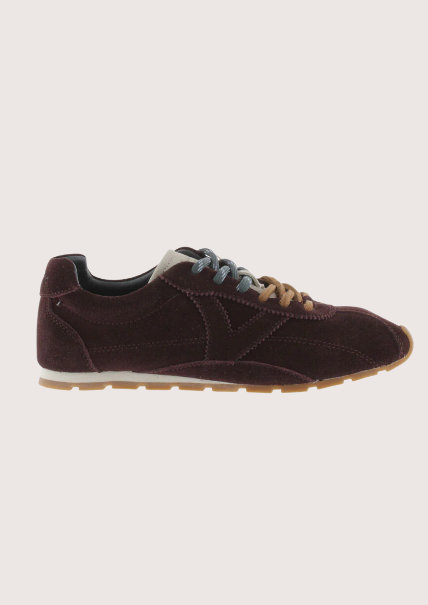 Brown suede sneaker with beige sole on a white background