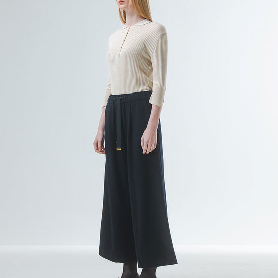 wide leg black culottes with drawstring waist and tie from emin and paul side view