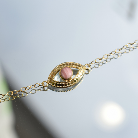 Gold evil eye bracelet with pink opal stone 