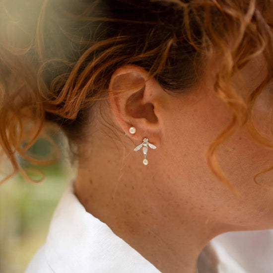 Silver flying bee stud earrings with butterfly fastening and teardrop pearl