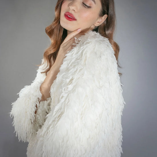 white faux fur feather effect short jacket side view 