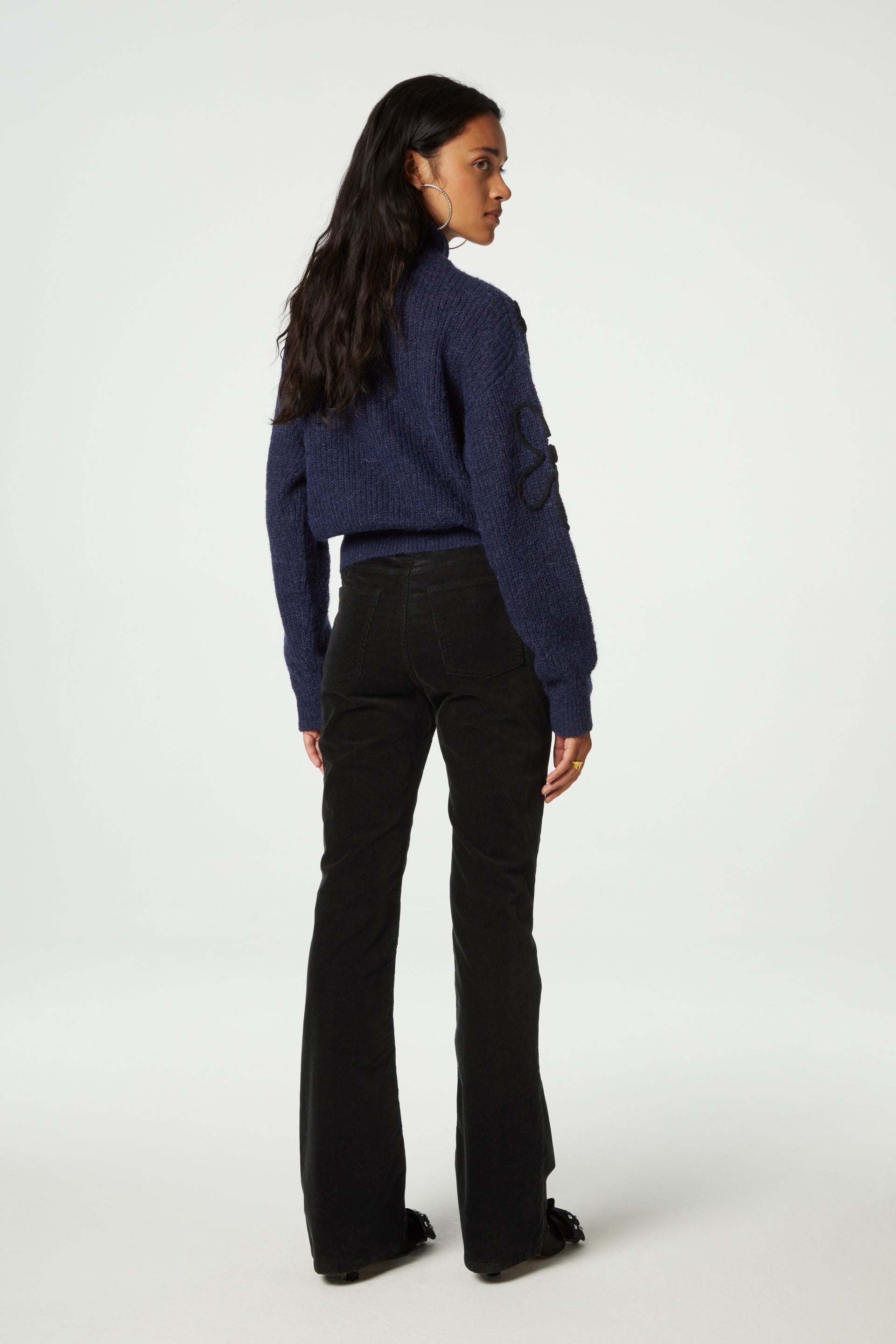 Navy turtleneck jumper with black knitted floral details