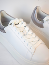 White chunky trainers with silver patch on back of heel 