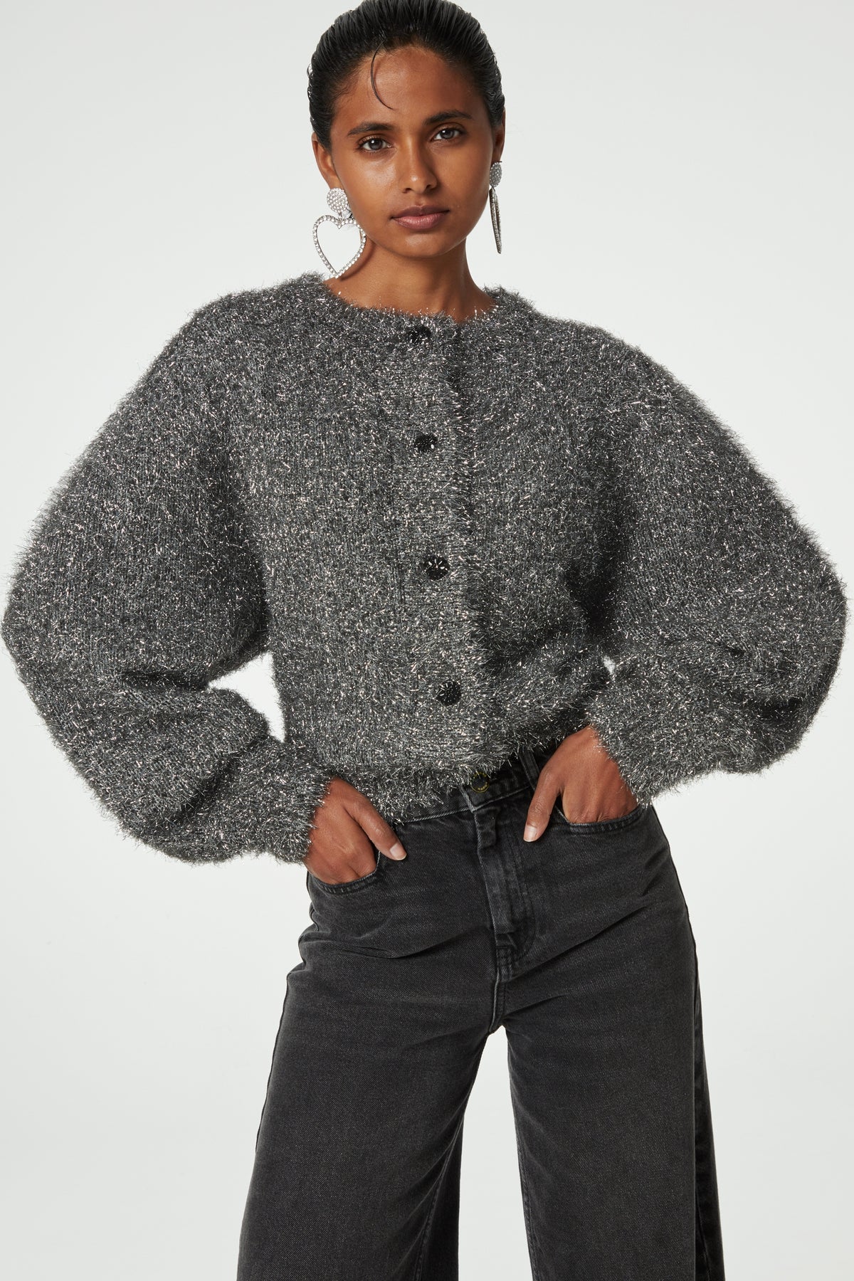 Silver tinsel effect knitted cardigan with wide sleeves crew neck and black button fastening