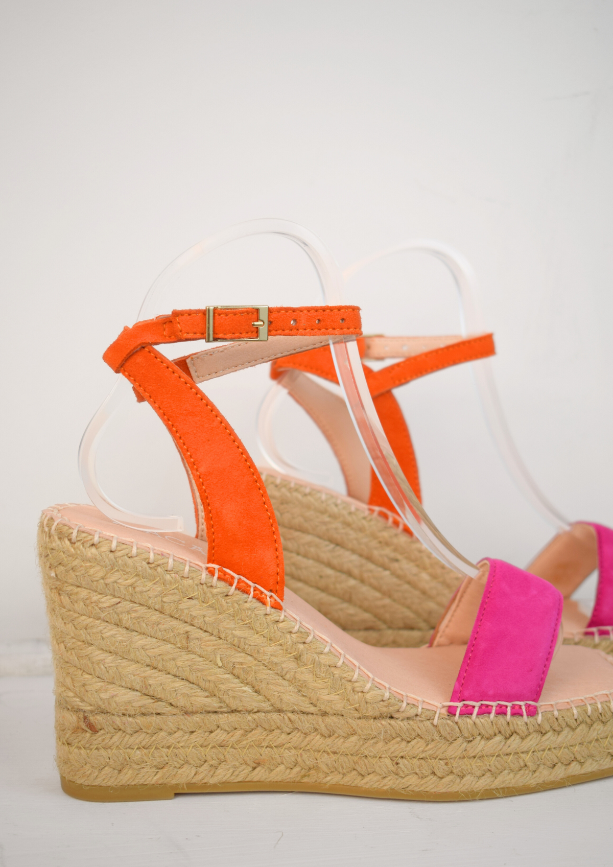 Raffia wedge sandle with pink toe strap and orange ankle strap. 