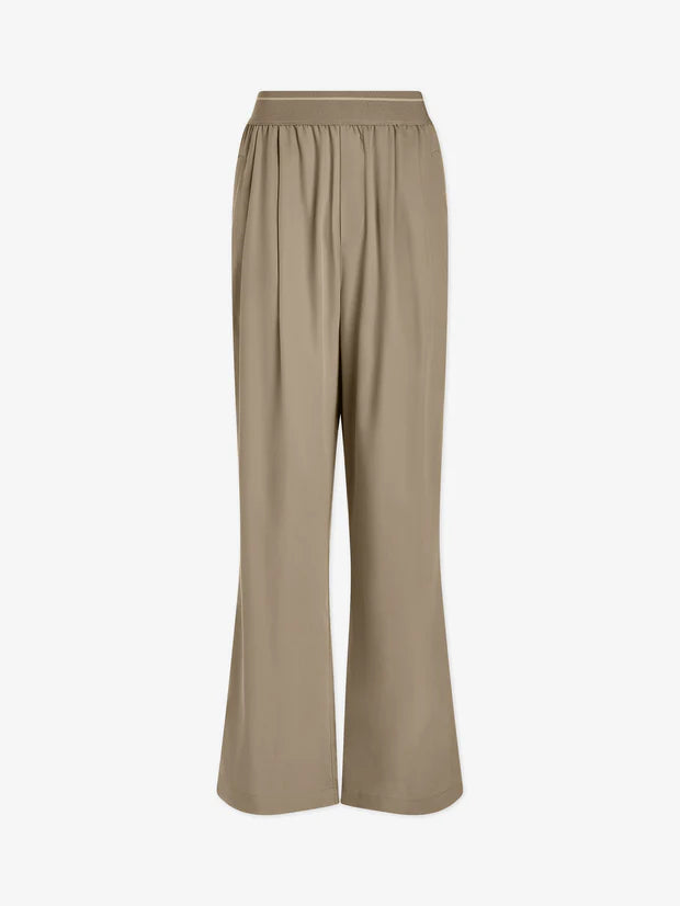 Image show loose fitting trousers in stone colour