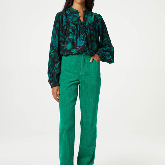 Straight cut vibrant green jumbo cord trousers with a turn up at the hem