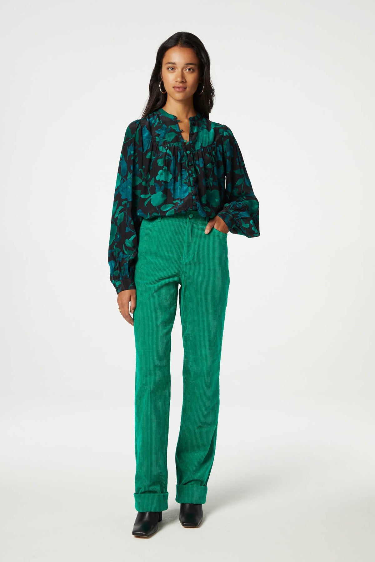 Straight cut vibrant green jumbo cord trousers with a turn up at the hem