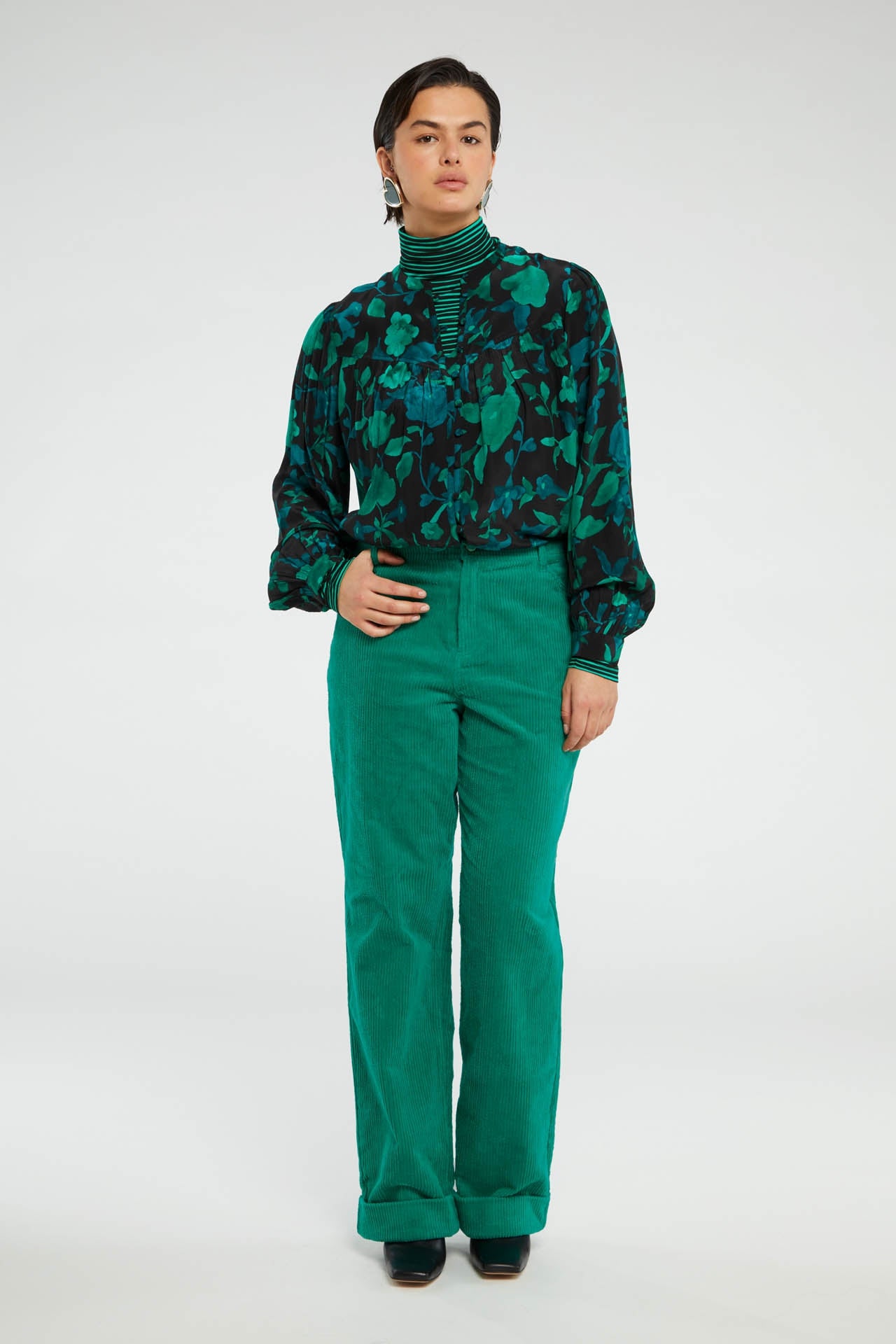 Straight cut vibrant green jumbo cord trousers with a turn up at the hem