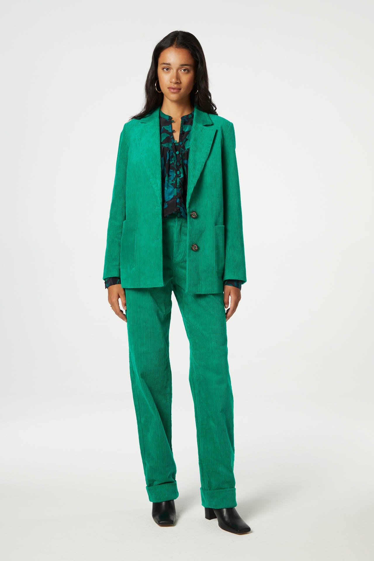 Straight cut vibrant green jumbo cord trousers with a turn up at the hem