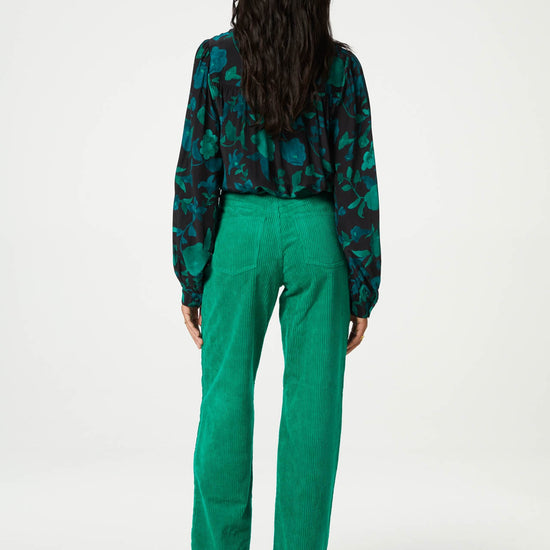 Straight cut vibrant green jumbo cord trousers with a turn up at the hem