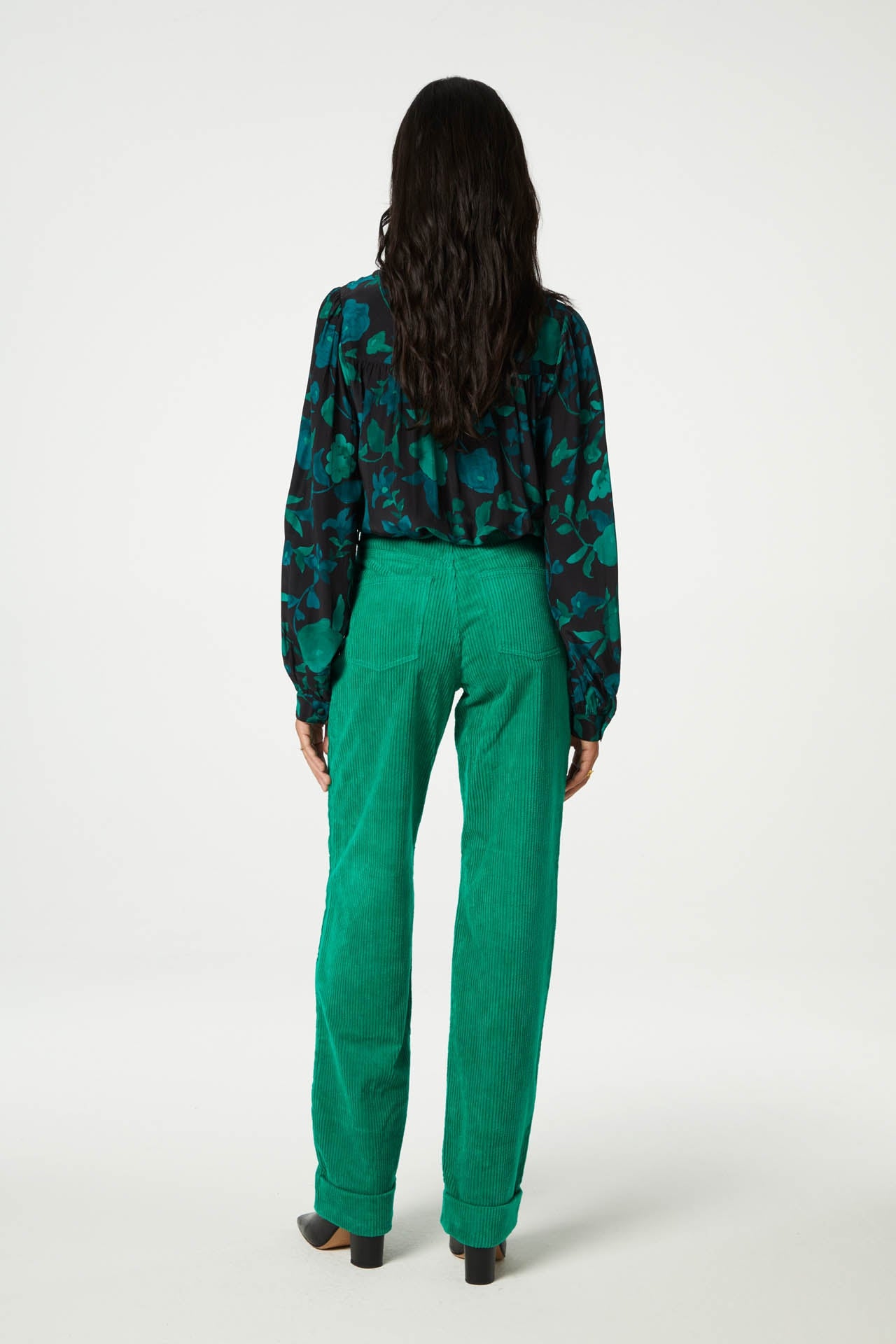 Straight cut vibrant green jumbo cord trousers with a turn up at the hem