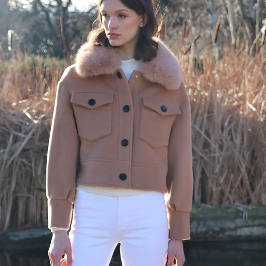 cropped tan wool jacket with covered buttons and 2 front flap pockets 