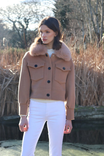 cropped tan wool jacket with covered buttons and 2 front flap pockets 