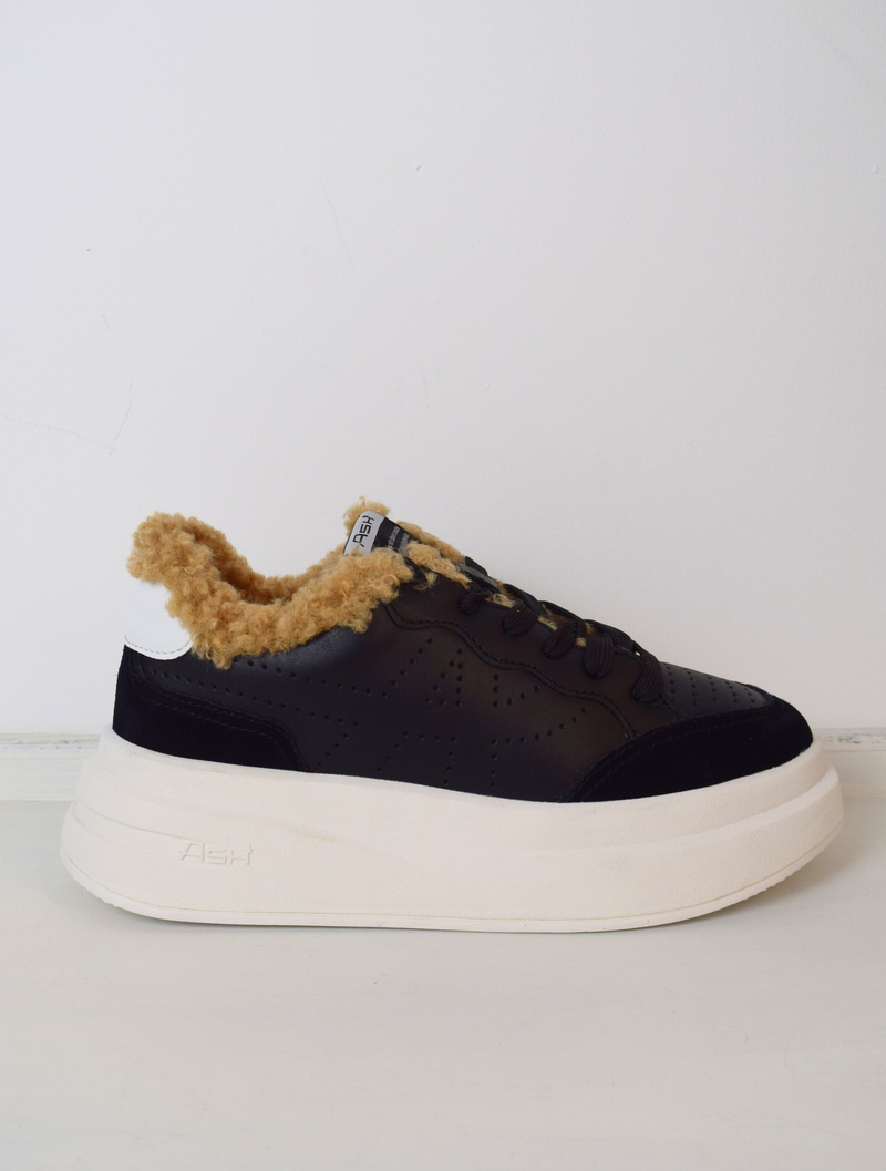 Black leather trainers with fur lining and chunky white sole