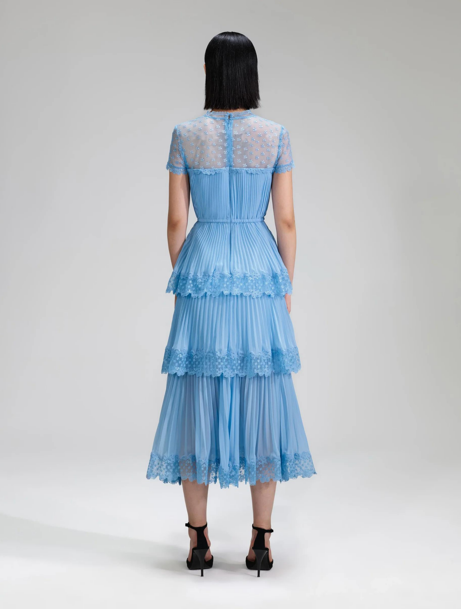 Light blue pleated chiffon lace trimmed midi dress with V neckline and lace shoulders