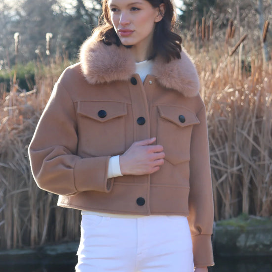 cropped tan wool jacket with covered buttons and 2 front flap pockets model shot