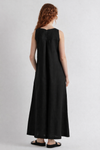 Woman wearing a black sleeveless dress on a white background