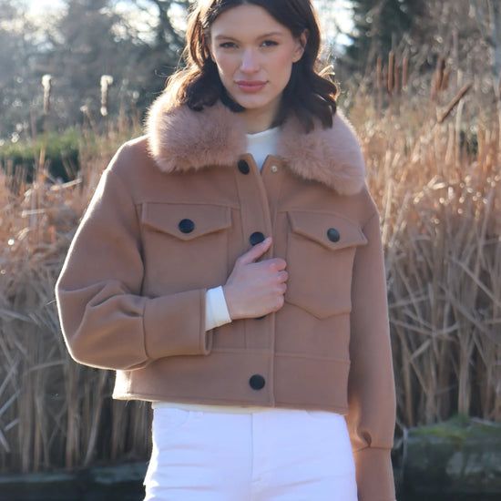 cropped tan wool jacket with covered buttons and 2 front flap pockets model shot