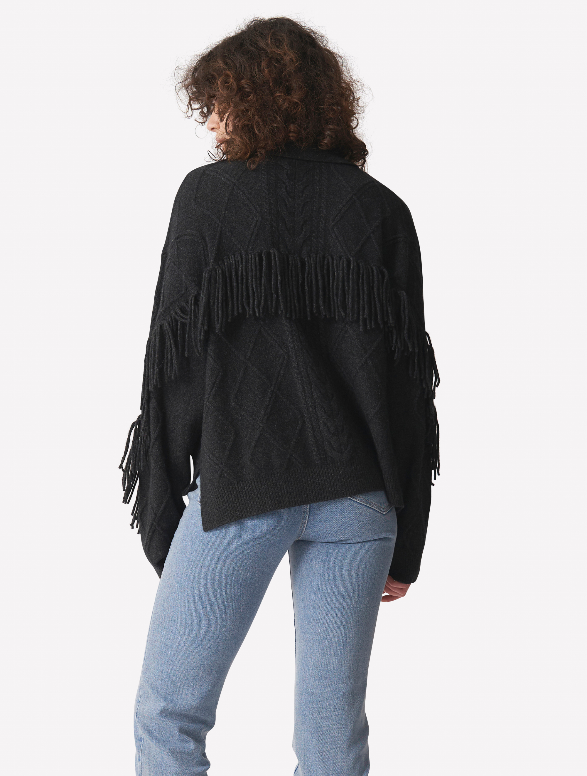 Charcoal grey cashmere polo neck jumper with dropped shoulders cable knit and fringing details across arms and back