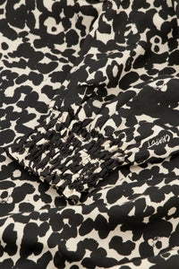 Black and ecru cat print long sleeved wrap dress