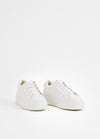 White leather trainer with platform sole and white laces