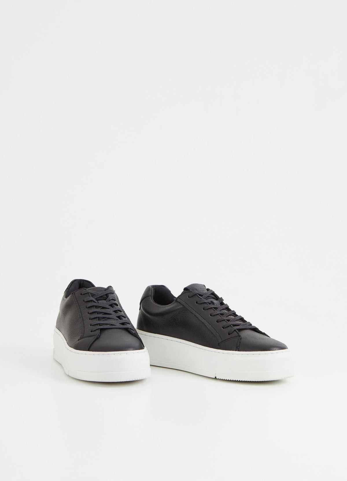 Black leather trainers with white chunky platform sole and heel