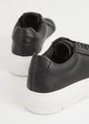 Black leather trainers with white chunky platform sole and heel