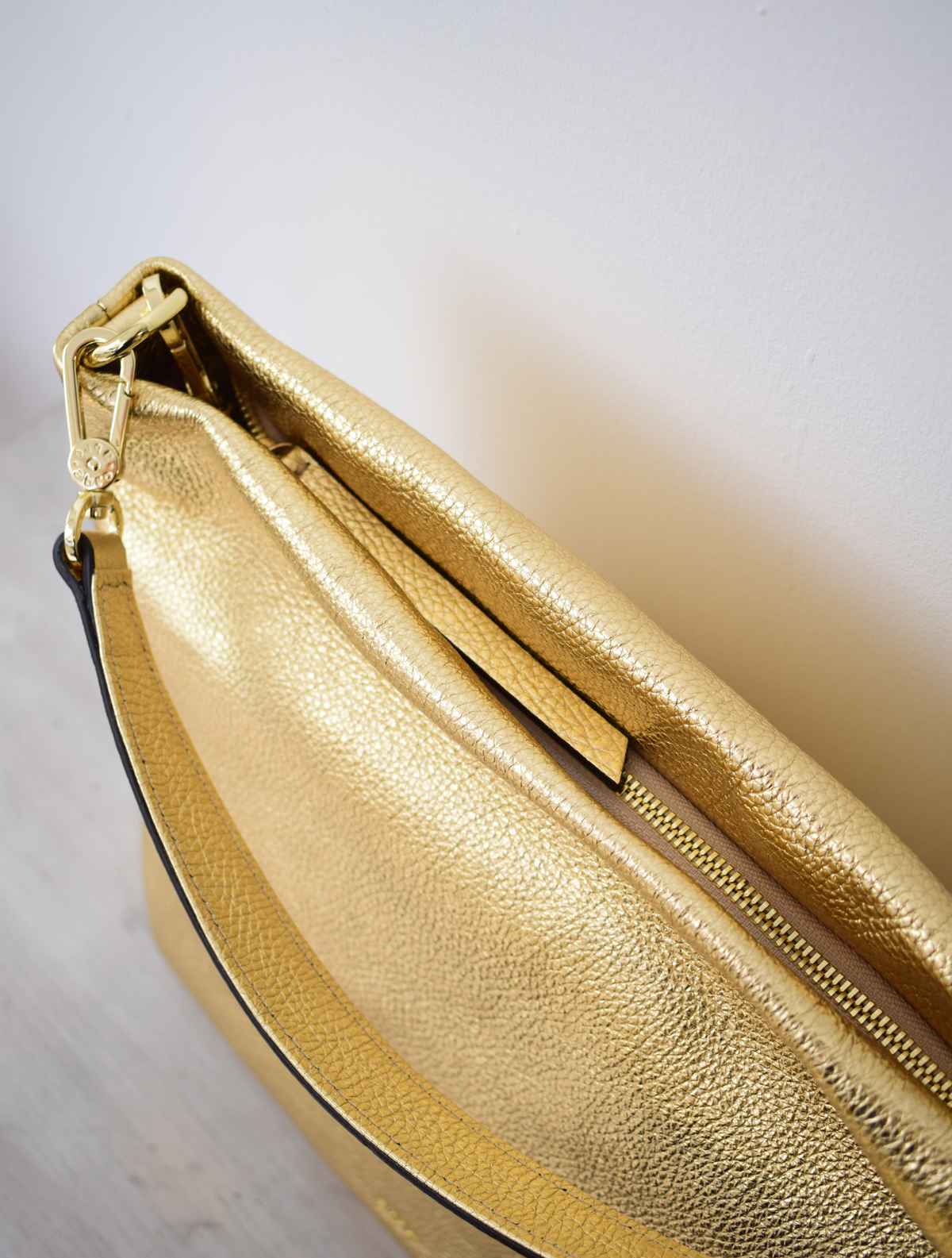 Gold coloured Italian leather handbag with shoulder and cross body strap