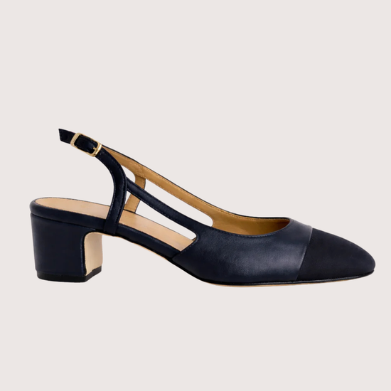 Navy blue shoe with a slingback on a white background