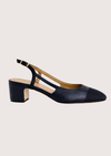 Navy blue shoe with a slingback on a white background