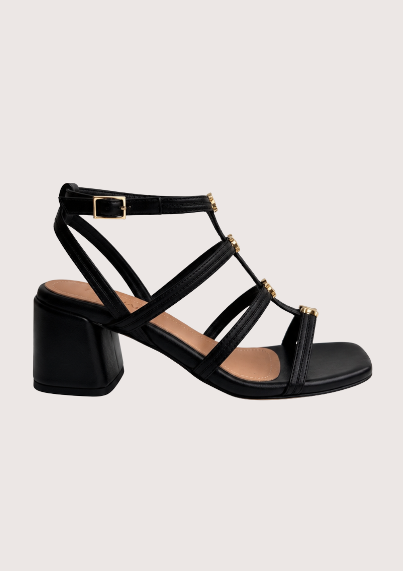 Black sandal with multiple straps on a light gray background