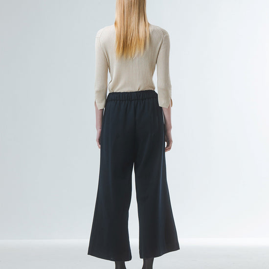 wide leg black culottes with drawstring waist and tie from emin and paul rear view