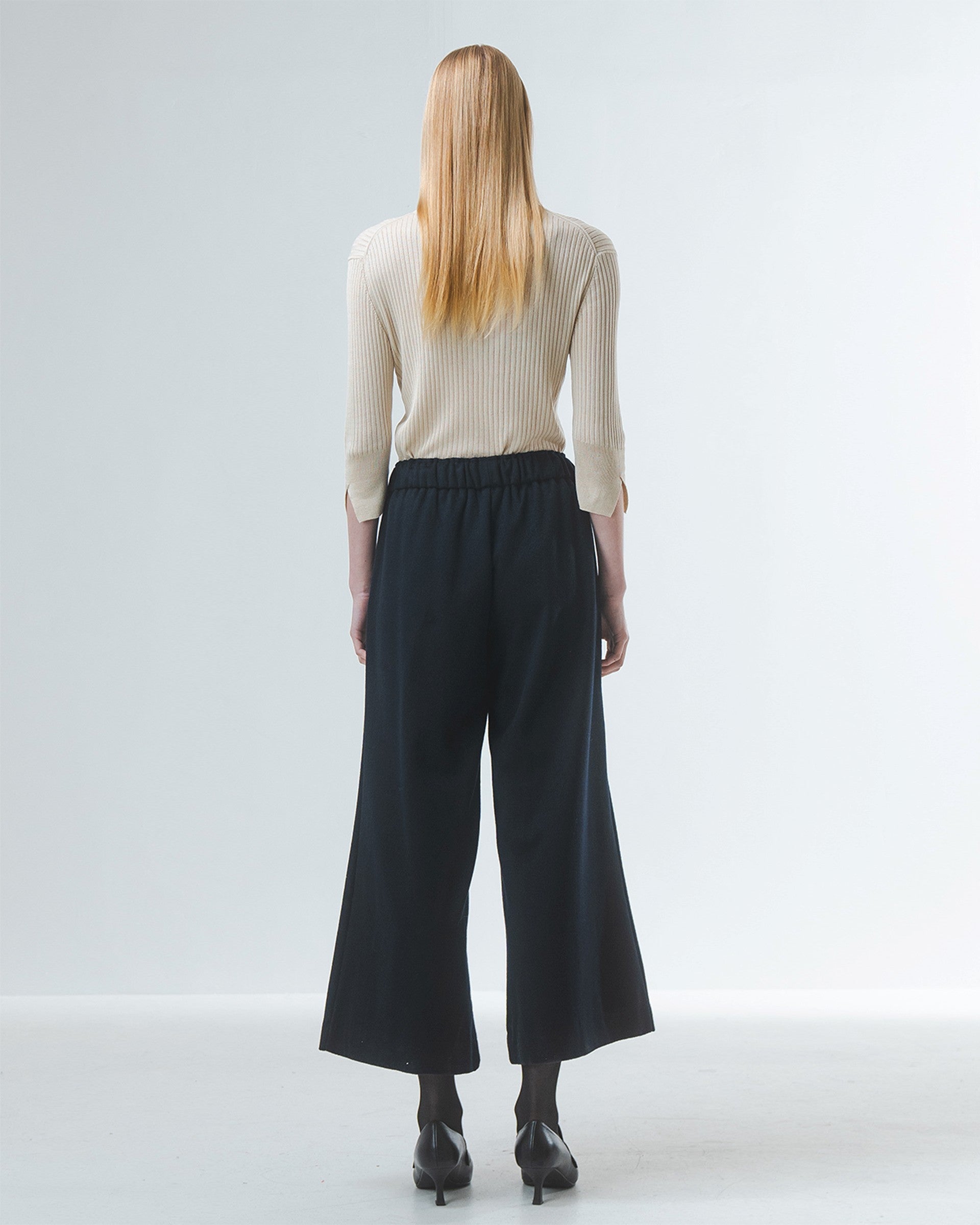wide leg black culottes with drawstring waist and tie from emin and paul rear view
