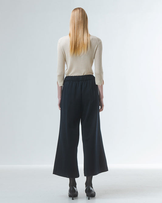 wide leg black culottes with drawstring waist and tie from emin and paul rear view