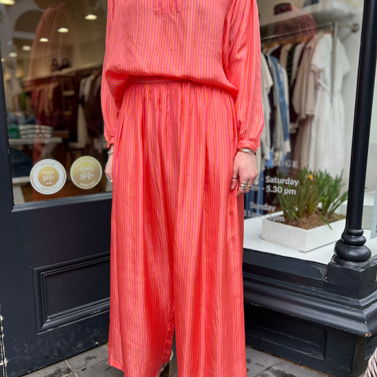 Loose orange and pink stripe trousers