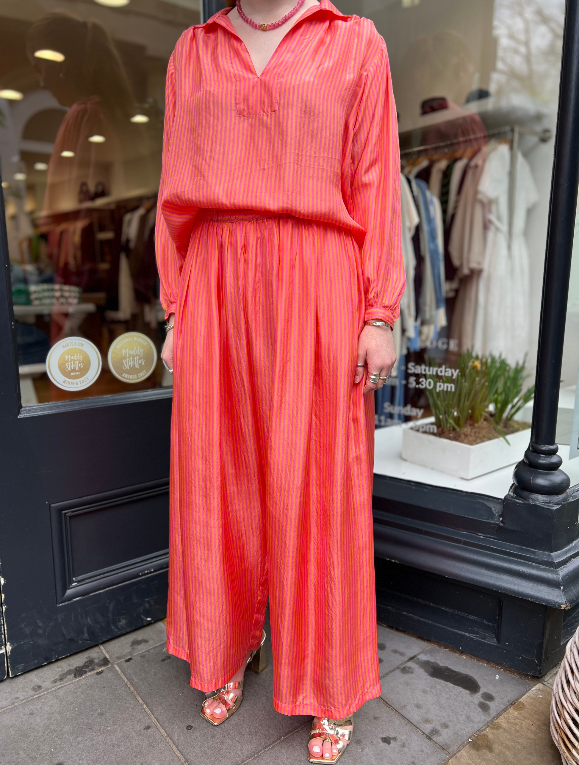 Loose orange and pink stripe trousers