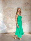 Model shot of green fit and flare dress from Sirens